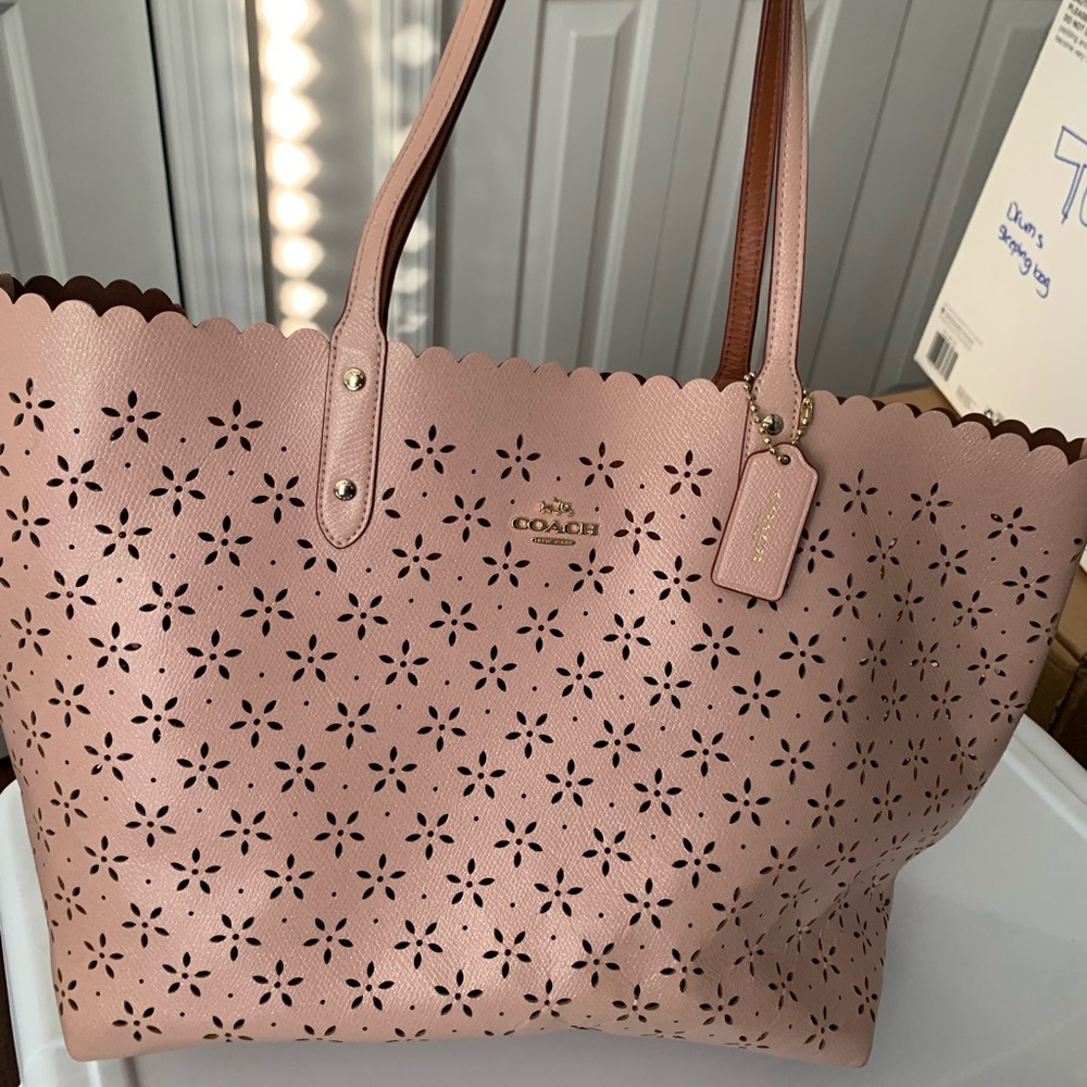 Floral perforated Coach tote